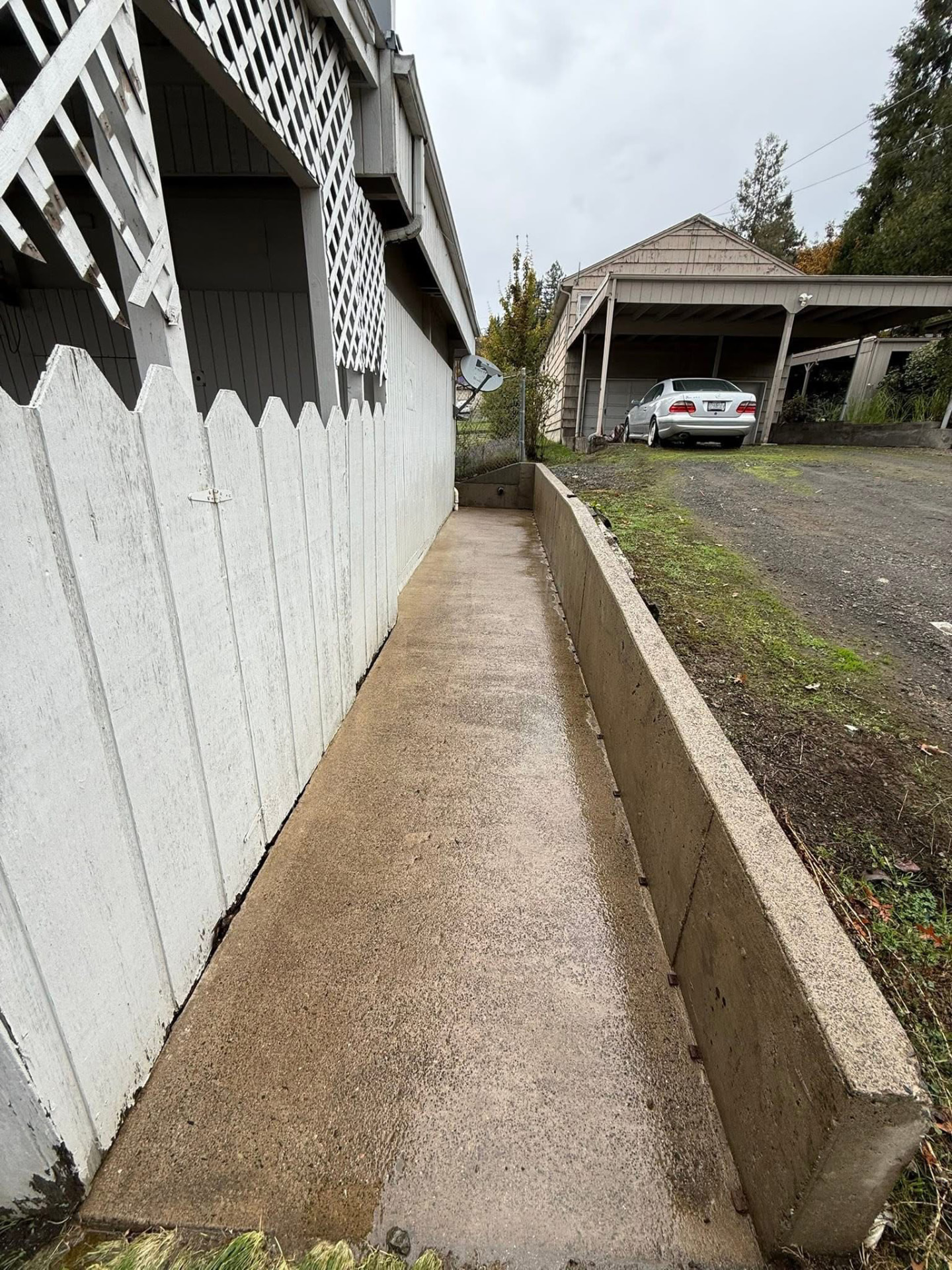 The same walkway cleared and washed down to clean concrete