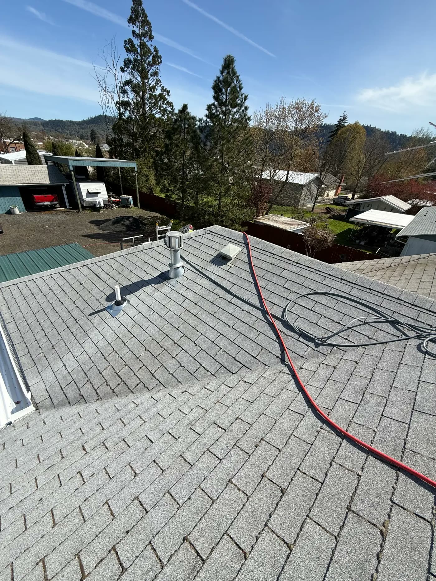 The same roof clean and uniform grey after a low-pressure soft wash
