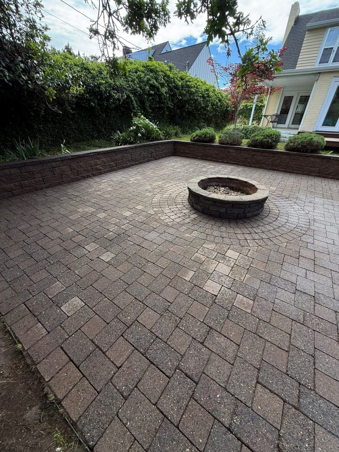 The same paver patio cleaned back to its original color after exterior cleaning